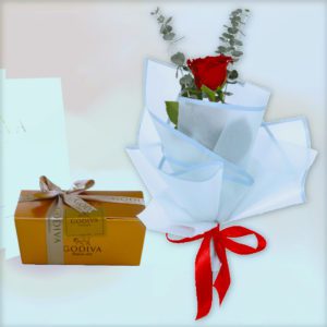 single rose in blue wrap with godiva chocolate