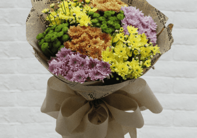 A bunch of chrysanthemums creates a beautiful and vibrant floral arrangement.