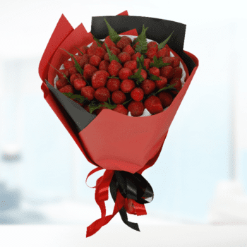 A vibrant bouquet of 101 fresh strawberries arranged beautifully, showcasing their bright red color and green leaves.