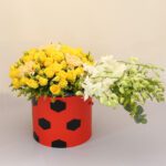 box of red roses with football design