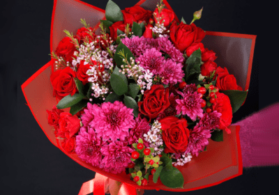 mix of Fuchsia, red roses, green flowers