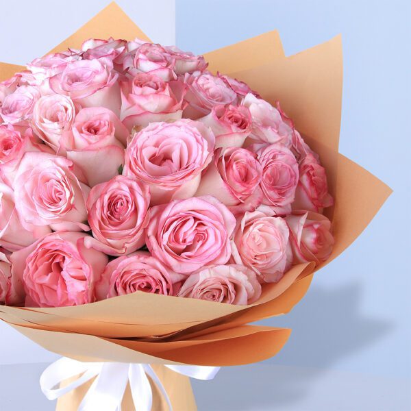 pink roses in brown wrap