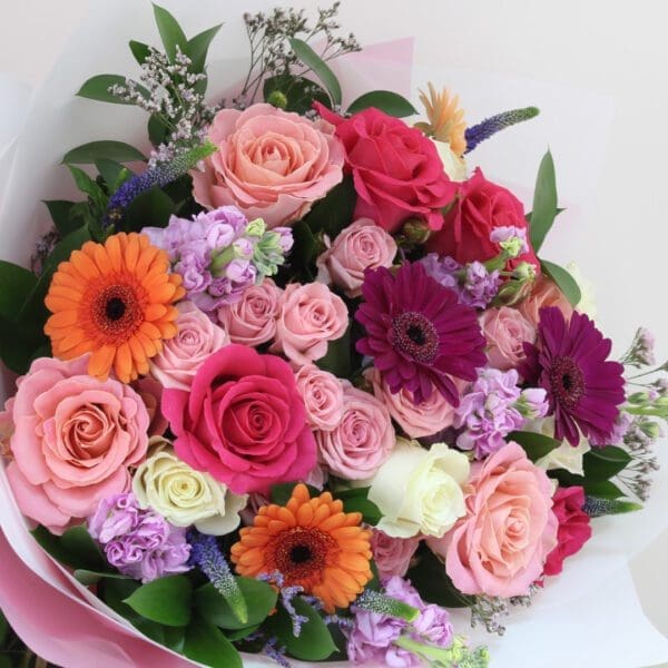 Gerbers and assorted roses bouquet 003 A vibrant bouquet of roses, Gerberas, and Mattiola, perfect for expressing love to a special recipient.