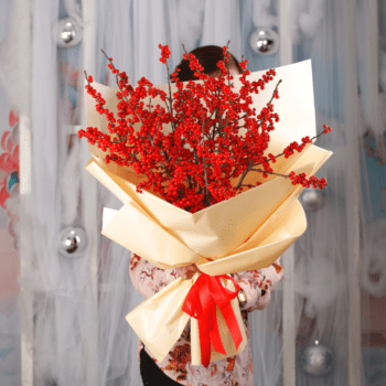 A vibrant Ilex berry bouquet, showcasing seasonal charm and festive beauty in a stunning arrangement of bright red berries.