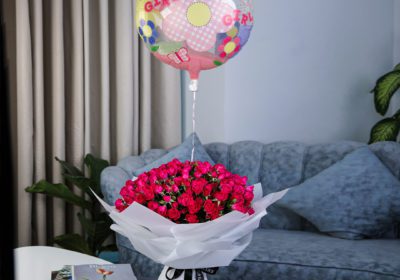 Striking Pink with Baby Girl Balloon and Patchi by Black Tulip Flowers