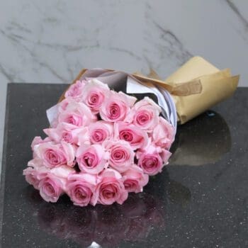 Handcrafted pink rose bouquet by Black Tulip Flowers, elegantly presented and ready for swift delivery in Qatar.