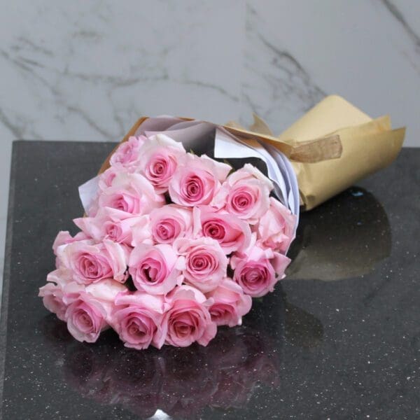 Handcrafted pink rose bouquet by Black Tulip Flowers, elegantly presented and ready for swift delivery in Qatar.