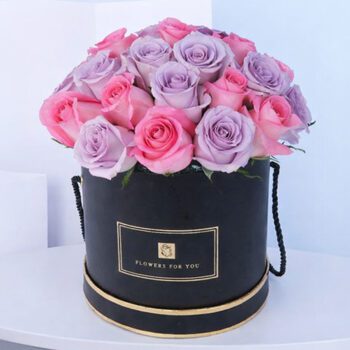 A romantic floral arrangement of pink and purple roses, symbolizing love and enchantment, adds elegance to any space.