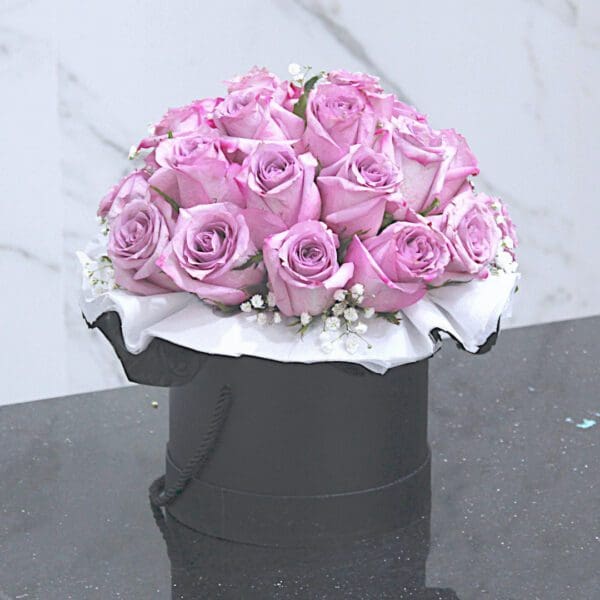 Black Tulip Flowers Qatar A special arrangement of purple roses in a decorative box, perfect for any occasion.