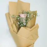 single pink roses wrapped