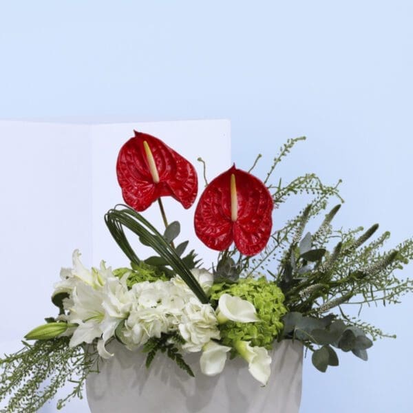 2 anthuriums, hydrangeas, lilies, and calla lilies.