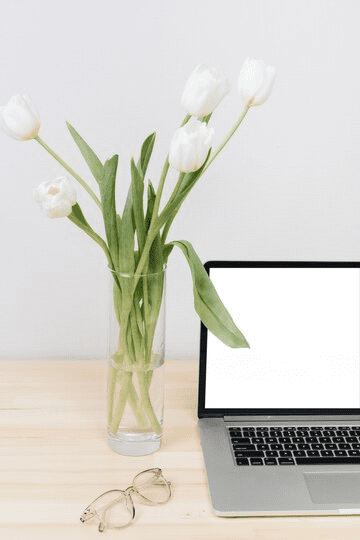 tulips in vase on the office table