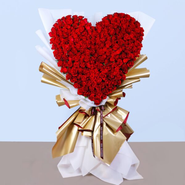 Heart-shaped bouquet-like flower arrangement of 500 red roses – romantic floral gift.