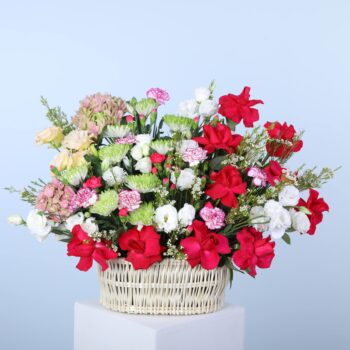 An elegant basket overflowing with fresh flowers, beautifully arranged to showcase the rich colours and textures of autumn.