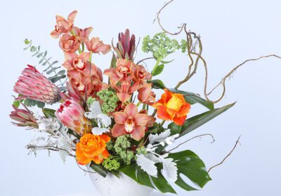 Mixed flowers vase featuring a delightful assortment of vibrant blooms for a charming home decor touch.