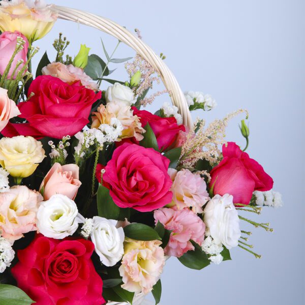 Vibrant Floral Arrangement Featuring Various Shades of Roses in a Basket