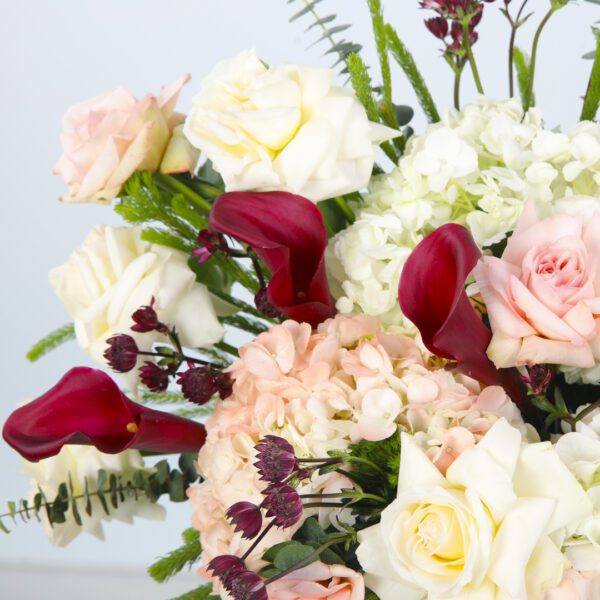 Stunning Floral Arrangement of Peach Roses and White Hydrangeas in a Black Hat Box