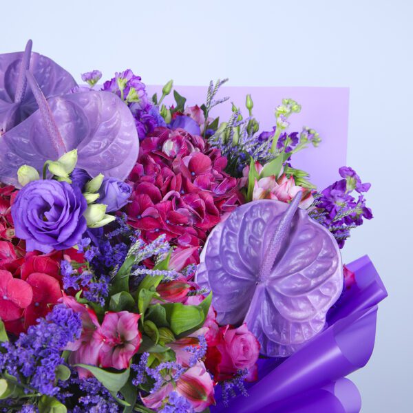 A stunning purple bouquet showcasing a vibrant mix of blooms, perfect for an elegant floral display.