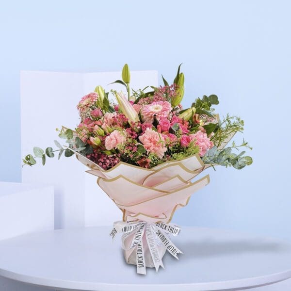 1 Pretty in Pink A beautiful bouquet of pink flowers tied up with a white ribbon.