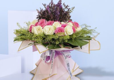 Sophisticated floral design featuring roses in soft hues, ideal for gifting or home decor.