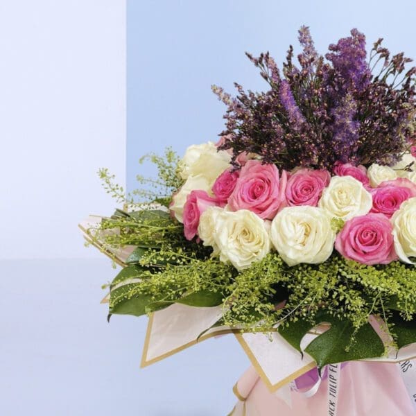 2Heavenly Bloom Delight Sophisticated floral design featuring roses in soft hues, ideal for gifting or home decor.