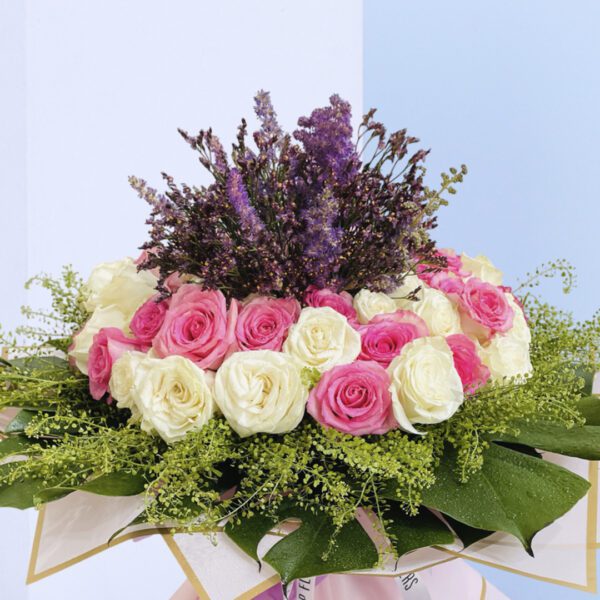 Sophisticated floral design featuring roses in soft hues, ideal for gifting or home decor.