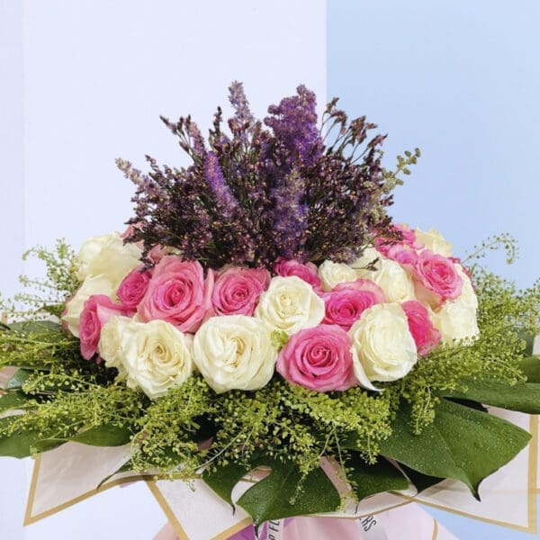 4 Heavenly Bloom Delight Sophisticated floral design featuring roses in soft hues, ideal for gifting or home decor.