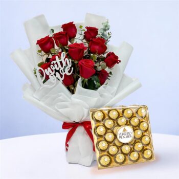 Stunning bouquet of a dozen red roses alongside a box of Ferrero chocolates, perfect for a romantic gesture.