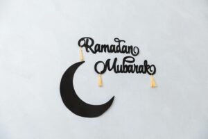 Ramadan Mubarak decorations on a light-colored wall.