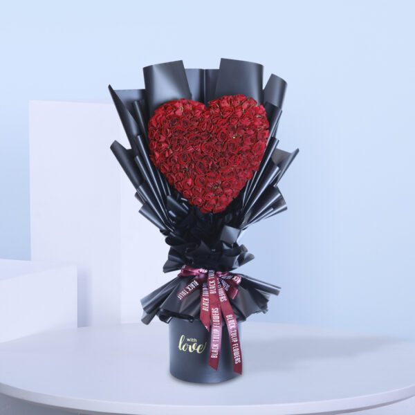 Exquisite bouquet of red roses in a heart shape.