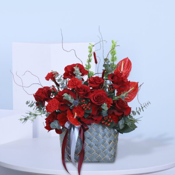 Classic red flower basket for festive occasions.