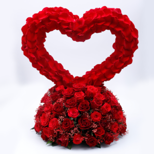 Heart-shaped arrangement of red roses.