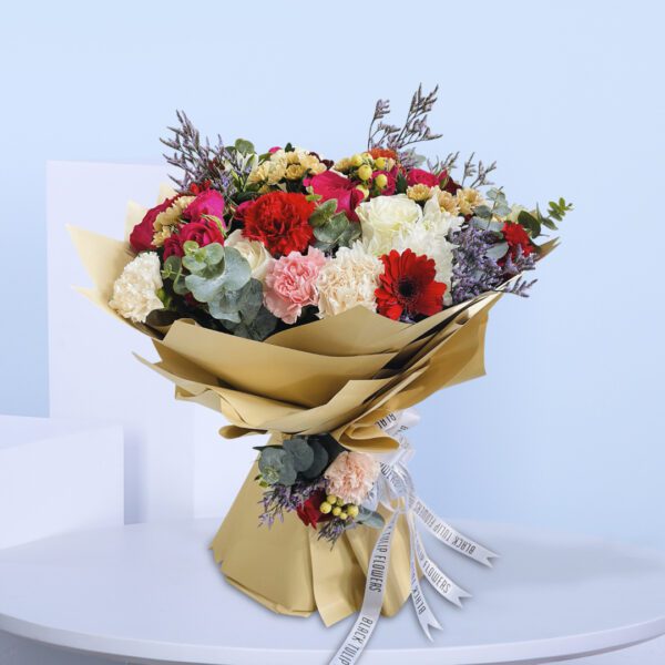 Bouquet with red, white, and pink roses, carnations, and gerberas, wrapped in stylish kraft paper.