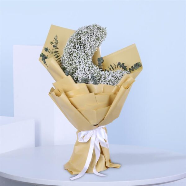 Half-moon floral arrangement featuring delicate white flowers.