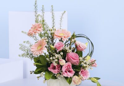 Surprise Mom with a gorgeous pink floral arrangement featuring roses, gerberas, and white accents—perfect for expressing love on Mother’s Day.