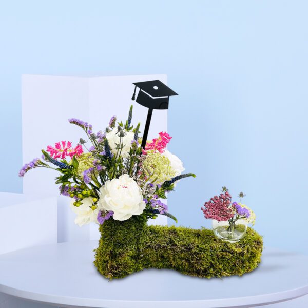 A decorative vase topped with a graduation cap, symbolizing academic achievement and celebration.