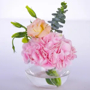 Bring on happiness and joy on your favorite one’s face by gifting them this “Pink Hydrangea Centerpiece” flower arrangement.