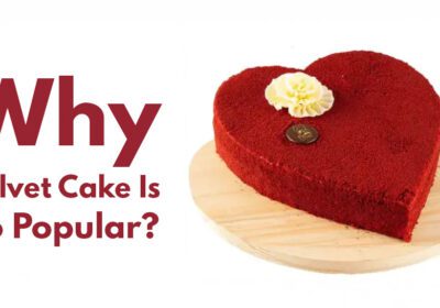 Close-up of a slice of red velvet cake with cream cheese frosting on a plate