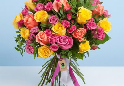 A Stunning Bouquet Featuring Pink And Yellow Roses, Elegantly Presented As A "Rose Garden Bouquet."