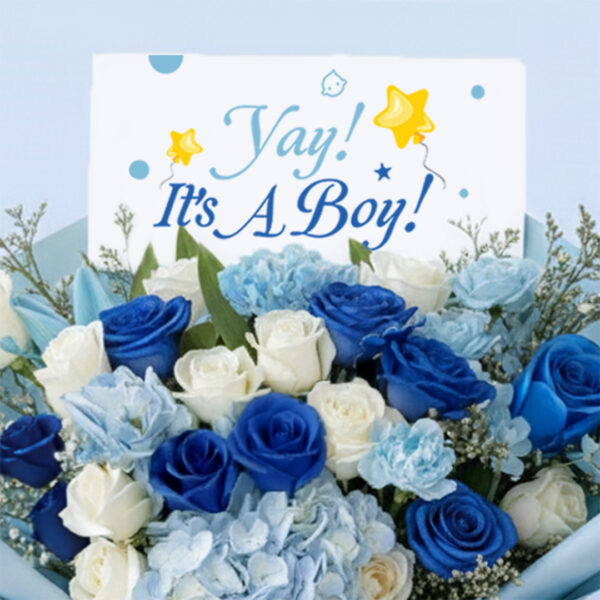 Blue baby boy bouquet with roses, hydrangeas, and other blooms and “It’s a Boy” card.