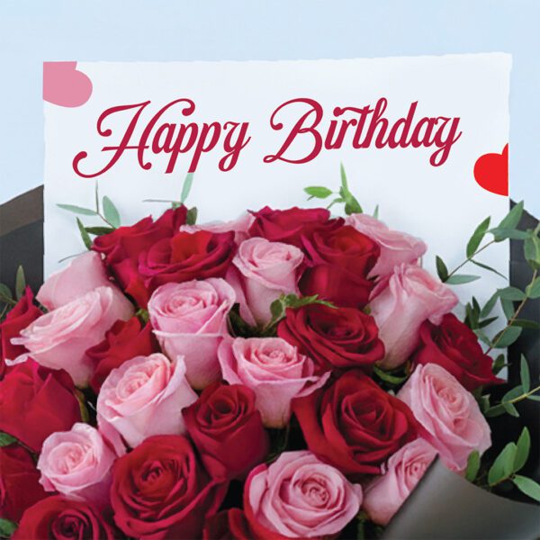 02 Birthday bouquet with pink and red roses wrapped in black paper and bright ribbon.