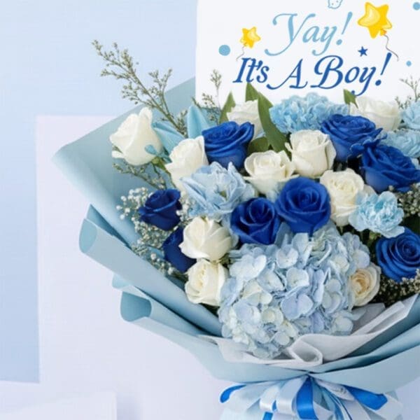 04 Blue baby boy bouquet with roses, hydrangeas, and other blooms and “It’s a Boy” card.