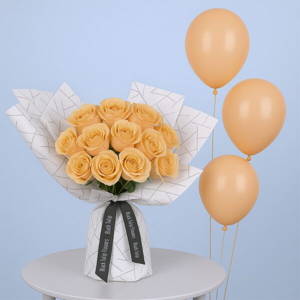 12 Peach Roses & Balloons 12 peach roses in patterned white wrap, paired with matching peach balloons.