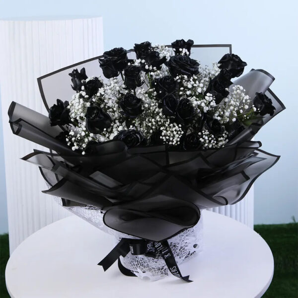 black-painted-rose-bouquet Black painted roses with baby’s breath in black luxury wrapping.