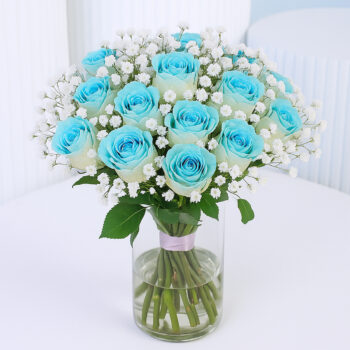20 Painted blue roses with baby’s breath in a clear glass vase.