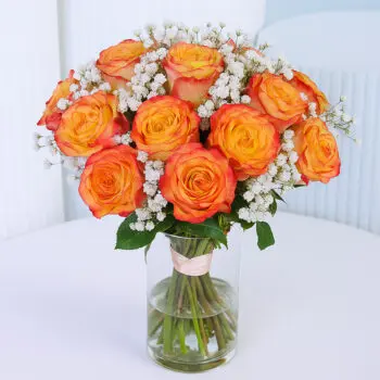 20 double orange roses with baby’s breath in a clear glass vase.