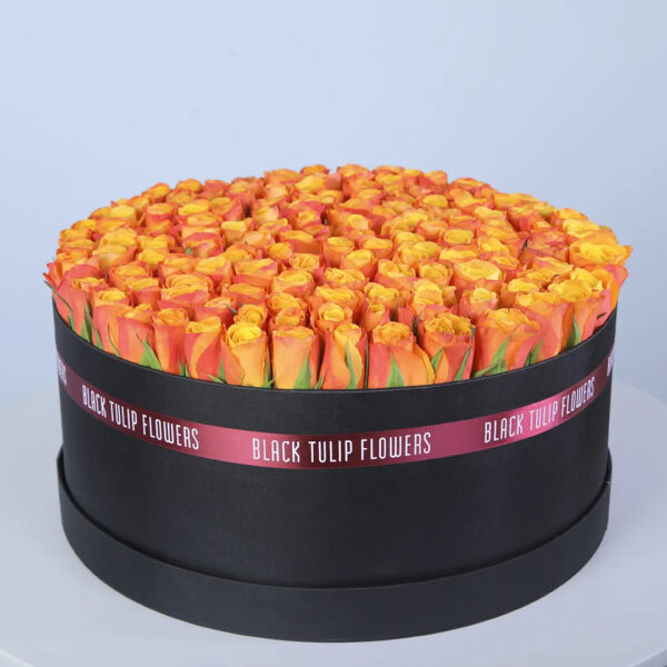 orange-roses-box-luxury 100-120 orange roses in a luxury black hatbox, finished with branded ribbon.