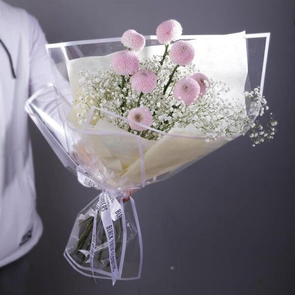 purple-ping-pong-gypso-bouquet Bouquet featuring hand-tied purple ping pong and baby’s breath in a clear wrap, finished with branded ribbon.