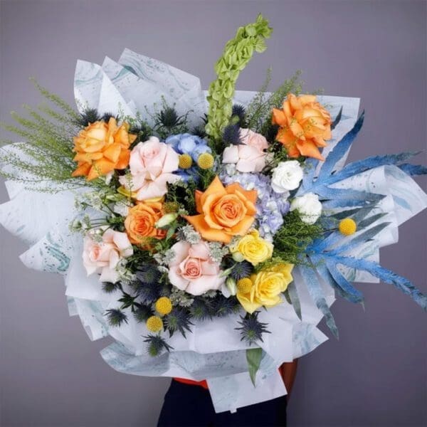 roses-hydrangea-exotic-bouquet Bouquet featuring hand-tied roses, hydrangeas & exotic flowers in designer wrap, finished with lush greenery.
