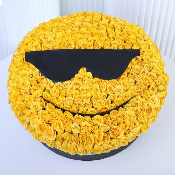 yellow-rose-cool-smiley-box. Yellow spray roses arranged in a cool sunglasses smiley-face floral box design.